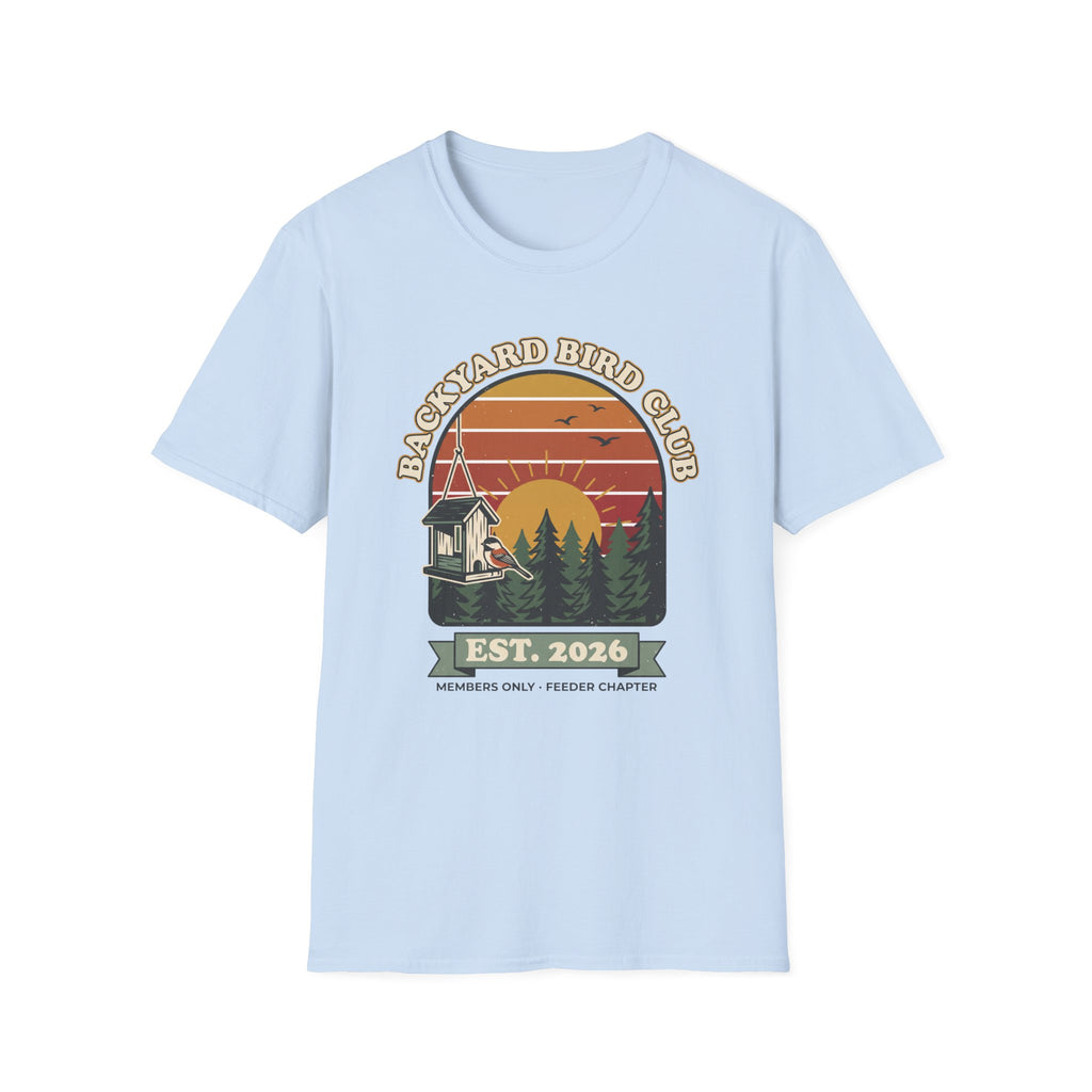 T-shirt with retro 'Backyard Bird Club Est. 2026' badge design featuring a sunset, pine trees and a chickadee at a bird feeder