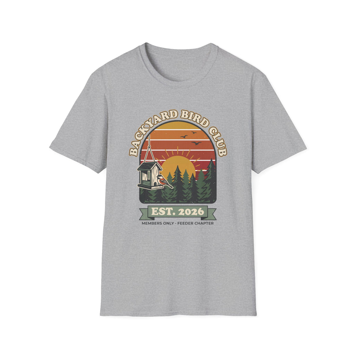 T-shirt with retro 'Backyard Bird Club Est. 2026' badge design featuring a sunset, pine trees and a chickadee at a bird feeder
