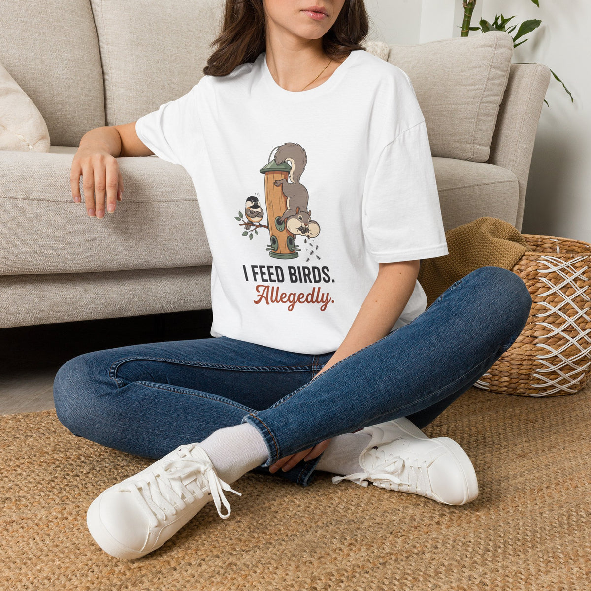 T-shirt with funny 'I Feed Birds. Allegedly.' design of a squirrel raiding a bird feeder while a chickadee glares