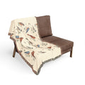 Woven throw blanket with vintage songbird pattern of chickadees, cardinals, bluebirds and robins