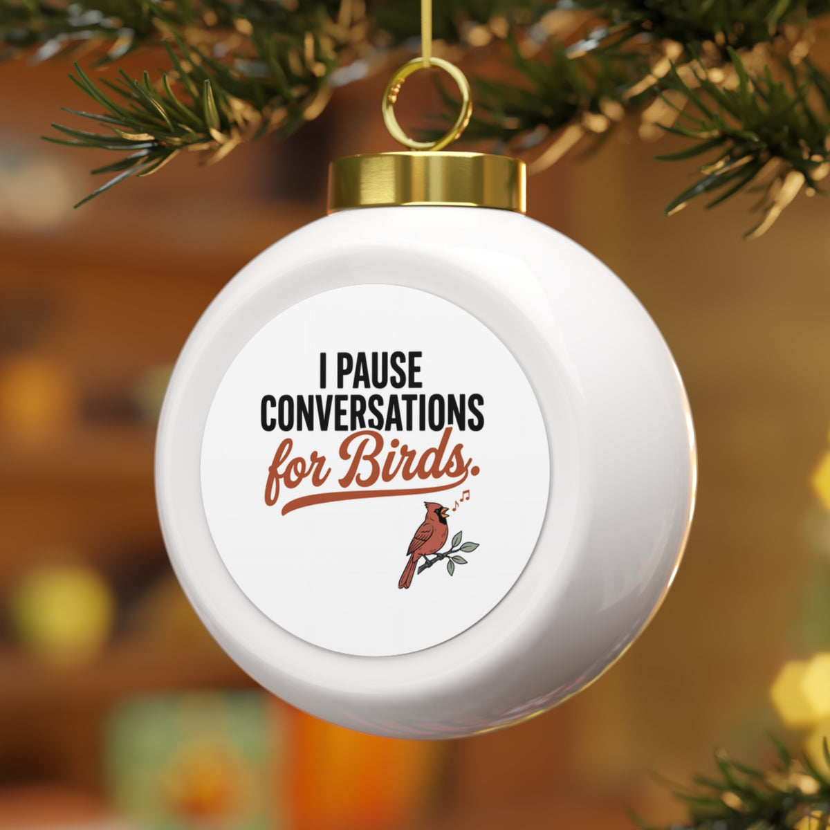 Round Christmas ornament with 'I Pause Conversations for Birds' cardinal design